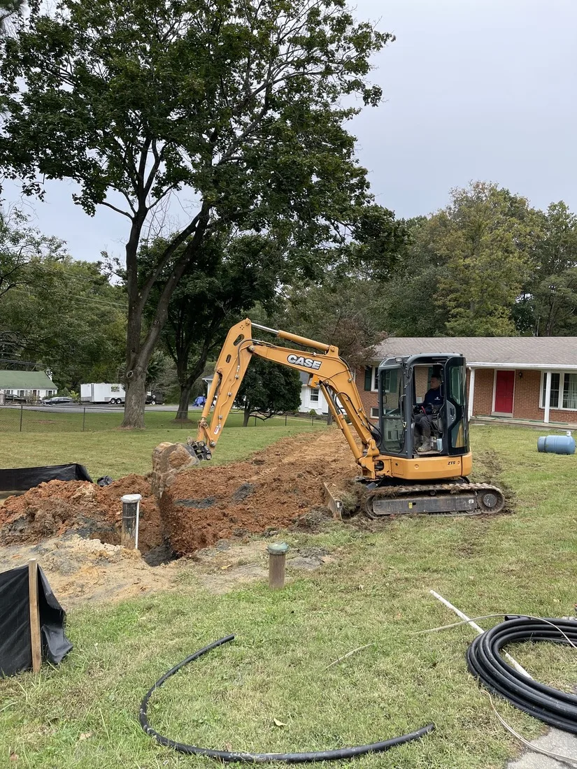 Excavator working at a wellhead on a Maryland property