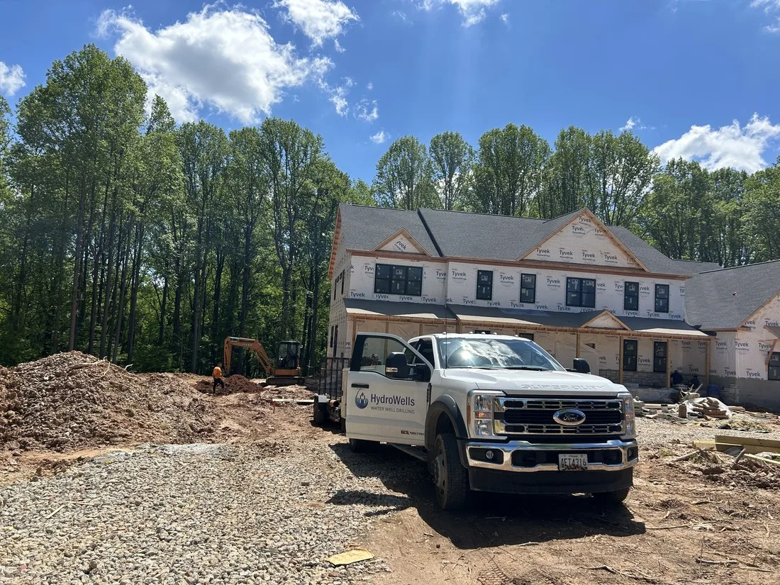 HydroWells truck drilling the well at a new construction site