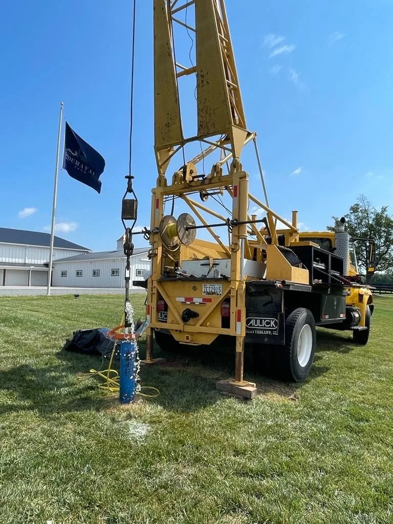 Drill rig positioned on a residential lawn