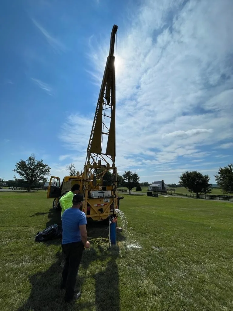 Well drilling rig with its mast raised on a Maryland property