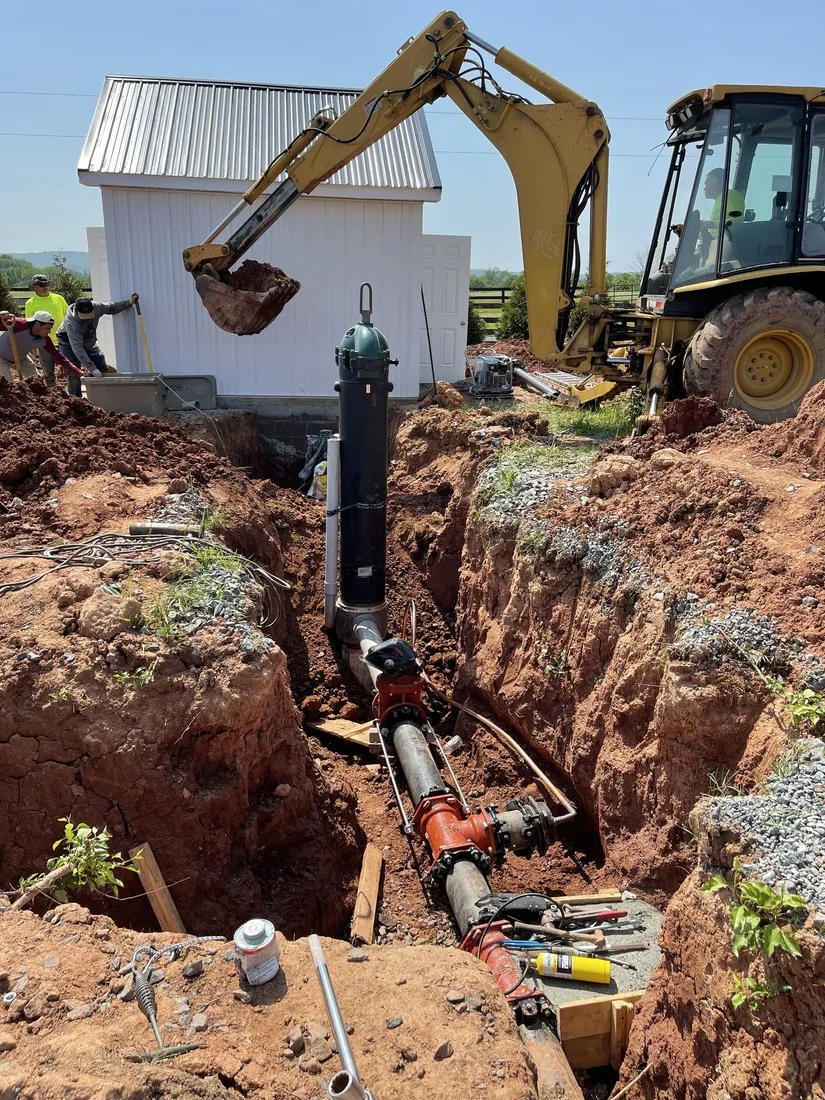 Water line trench connecting the wellhead toward the house